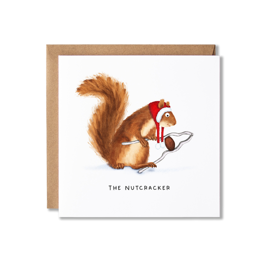 Christmas card with illustration of a red squirrel in a Santa hat holding a huge pair of nutcrackers with a nut in it, with the message The Nutcracker.