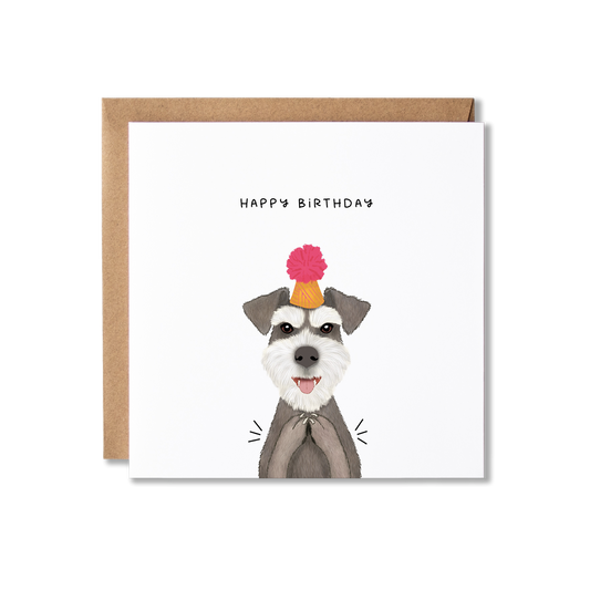 Birthday card with illustration of a Schnauzer dog in an orange party hat with a pink bobble on top, clapping with the message Happy Birthday.